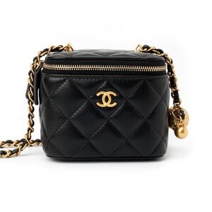 CHANEL Black Mini Bag with Gold Accents